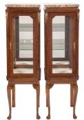 A pair of French amboyna veneered, inlaid and brass mounted square upright display cabinets:,