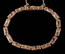 An amethyst and seed pearl bracelet: with attached safety chain, the clasp stamped '9ct V & C',