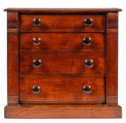 A Victorian style mahogany miniature apprentice's chest: of rectangular outline containing four