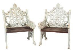 A set of four Coalbrookdale type cast iron garden armchairs:,