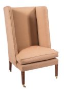 An Edwardian mahogany frame high wing back armchair:,