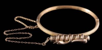 A hinged bangle with attached propelling pencil: the plain polished propelling pencil within a