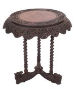 A 19th century Indian carved hardwood circular centre table,