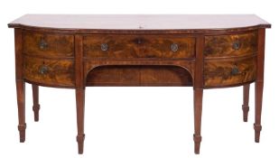 A 19th Century mahogany bow-fronted sideboard:, the top with a moulded edge,