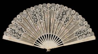 A late Victorian ivory and lace fan: the painted gauze leaf inset with lace panels,
