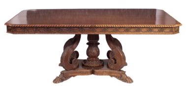 A 19th Century Indian carved hardwood rectangular dining table:, of large size,