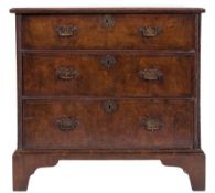An 18th century walnut and crossbanded rectangular chest:, of comparatively small size,