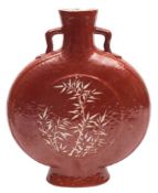 A Chinese coral ground moon flask: the short branch handles with ruyi-head terminals,