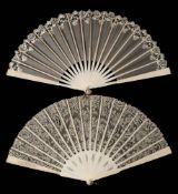 An Edwardian ivory fan: with machine made lace leaf with pierced sticks and guards, 24cm.