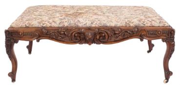 A Victorian carved walnut rectangular stool of large size:,