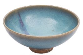 A Chinese Junyao purple-splashed bowl: of circular form and covered with a thick mottled