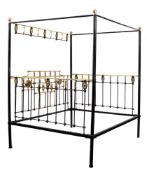 A late 19th/early 20th Century brass and iron four poster bed:,