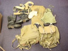 A collection of various canvas bags, a rucksack and a pair of black leather boots:,