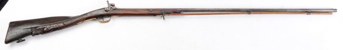 A 19th century Continental percussion cap fowling gun:,