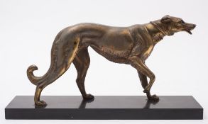 After Irenee Rochard, an Art Deco spelter figure of a dog:, raise on a black slate plinth,