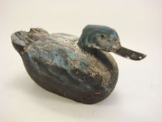 A carved wood and painted duck:, 24cm high.