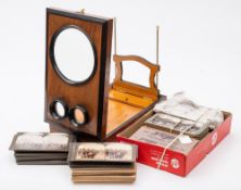 An early 20th century graphoscope and a collection of stereoscopic cards:,