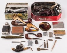 A collection of various pipes and related items:, including several silver mounted pipes,