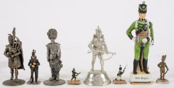 A group of seven various pewter and other metal figures of soldiers: and a ceramic example (8).