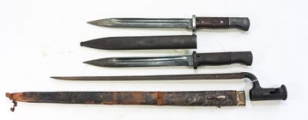Two WWII period German K98 pattern bayonets:, one with steel scabbard,