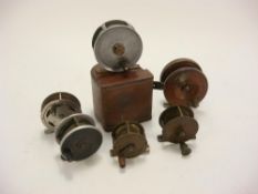 A Hatton Bro & Co 3 inch centre brake fly reel:, in leather case, together with two brass reels,