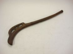 A carved wood lizard club:, of typical form, 67cm long.