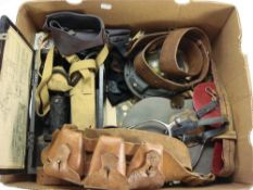 A group of miscellaneous militaria, including an epaulette tin, belts , compass etc:.