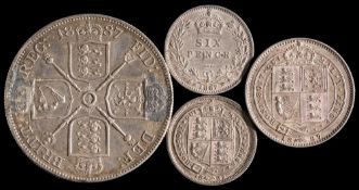 An 1887 Double Florin, a shilling and two sixpence:,