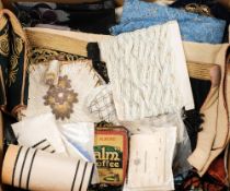 A quantity of various textiles:, including an unused bolt, lace net panels,