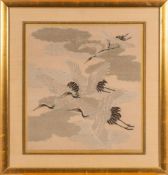 A late 19th century Japanese fukusa of flying cranes in clouds:, gilt and silk treads,