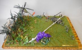 A 1/72nd diorama of a Vietnam war scene: with figures and helicopters, on a naturalistic base.
