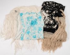 A black and white silk floral embroidered shawl with tassel fringe,