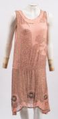 An early 20th Century French coral pink and silver beaded dress,