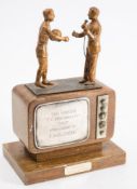 A gilt metal and wooden 'Soccer TV Personality of The Year' trophy for Kenneth Wolstenhome:,