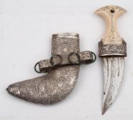 A late 20th century white metal mounted jambiya:, of traditional form,
