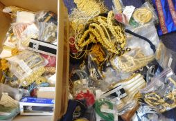 A large collection of assorted insignia, patches, epaulettes,