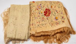A cream silk shawl with coloured floral embroidery and tassel fringe:,