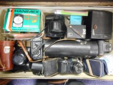 A quantity of various cameras and accessories including a canon T70,