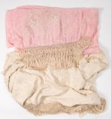 A pink silk scarf with white cotton floral decoration:,