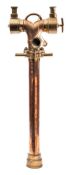 A 26 inch brass and copper stand pipe with divider:, unsigned,