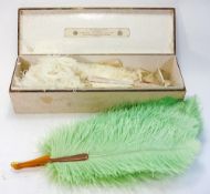 A white ostrich feather and abalone fan in fitted box with label for 'J Duvelleroy , London':,