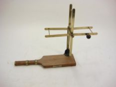A beech and brass line winder/dryer by Farlow & Co., London:.