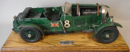 A 1/24th plastic scale model of a 1930's Bentley: mounted on a wood base.