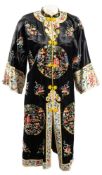 A group of five Chinese black silk and embroidered jackets:,