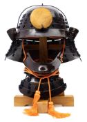 An Edo period collapsible Samurai helmet with mask (Chochin Kabuto):,