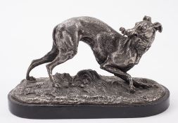 After Mene, a spelter model of a greyhound with a riding whip in its mouth:, on an ebony base,