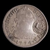 A 1774 Carolus III 2 reales with 12M counterstamp.