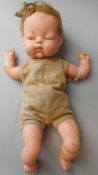 A Chiltern clockwork musical rubber doll: 32cm high.