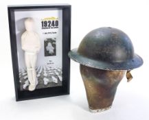 A 1939 Civil Defence hat and '19240 Shrouds of the Somme' figure No 01933 on presentation frame,