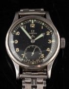 A WWII period military issue Omega wristwatch:, the stainless steel case with black dial,